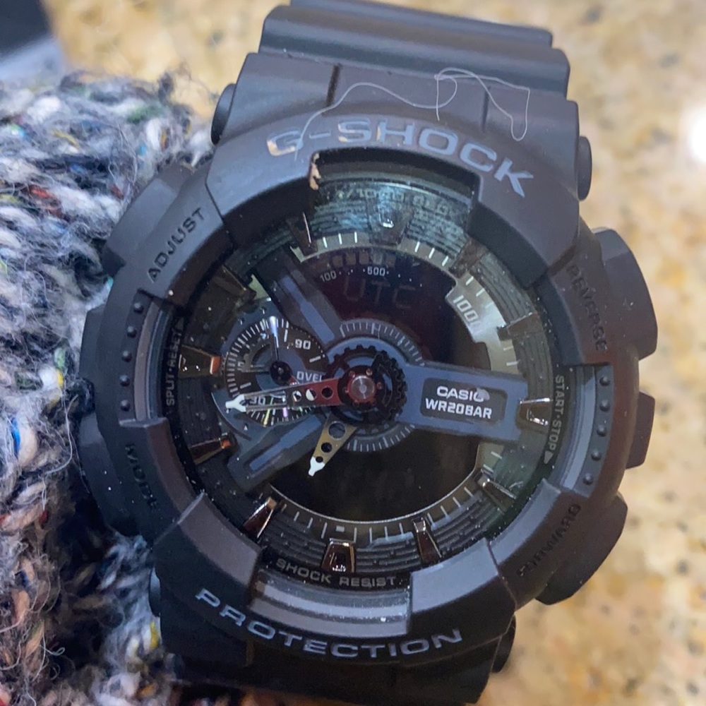 G-Shock black w/ grey chronograph with digital display. Battery operated.